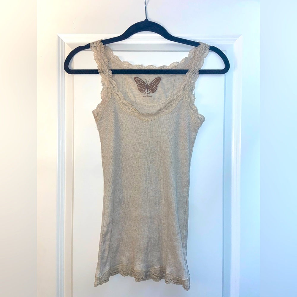 Tan Lacey tank top. Long with lace trim on hem, collar, and straps.